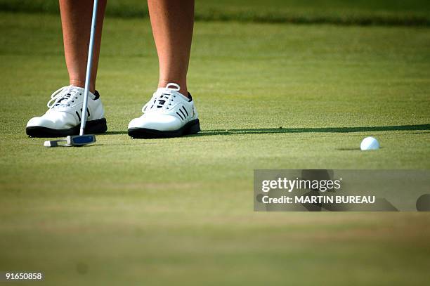 Australian Karrie Webb putts to the hole, 27 July 2006 in Evian-Les-Bains, central eastern France, on the second of the four days of the Golf Evian...