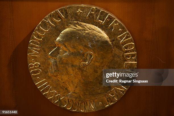 The plaque is displayed as Norwegian Nobel Committee Head Thorbjoern Jagland announces Barack Obama as the recipient of the Nobel Peace Prize on...