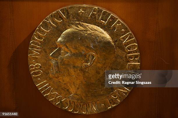The plaque is displayed as Norwegian Nobel Committee Head Thorbjoern Jagland announces Barack Obama as the recipient of the Nobel Peace Prize on...
