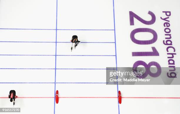 Ivanie Blondin of Canada crosses the line ahead of Claudia Pechstein of Germany during the Women's Speed Skating 3000m on day one of the PyeongChang...
