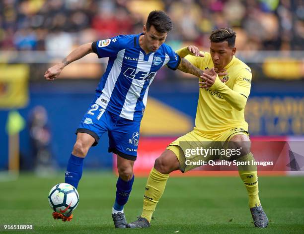 Roger Martinez of Villarreal competes for the ball with Hernan Perez of Deportivo Alaves during the La Liga match between Villarreal and Deportivo...