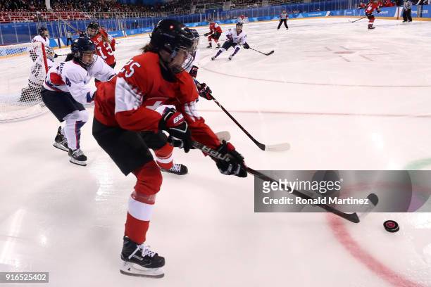 Alina Muller of Switzerland controls the puck against Korea during the Women's Ice Hockey Preliminary Round - Group B game on day one of the...