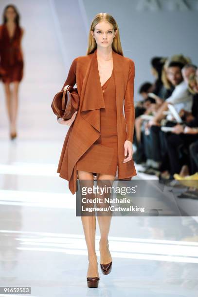 Model walks the runway during the Akris Ready To Wear show as part of the Paris Womenswear Fashion Week Spring/Summer 2010 on October 4, 2009 in...