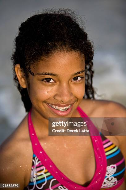 happy teenage girl at beach - derek latta stock pictures, royalty-free photos & images