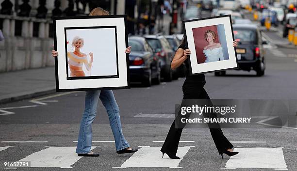 Lyon and Turnbull employees pose with two of the last photographs taken of Marilyn Monroe 'Marilyn Monroe in Stripe Scarf ' by Bert Stern and...