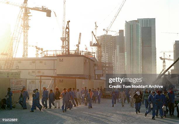 Workers leaving a construction site along the corniche in Doha, Qatar, May 2008. The country's huge oil and gas reserves have made it one of the...