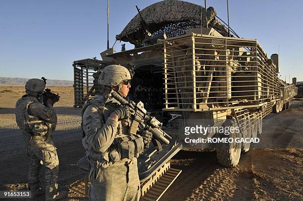 Army Specialists Daniel Brewer and Caleb McGoldrick from the 3rd Platoon, Charlie Company, 1st Infantry Regiment, 5th Stryker Brigade Combat Team,...