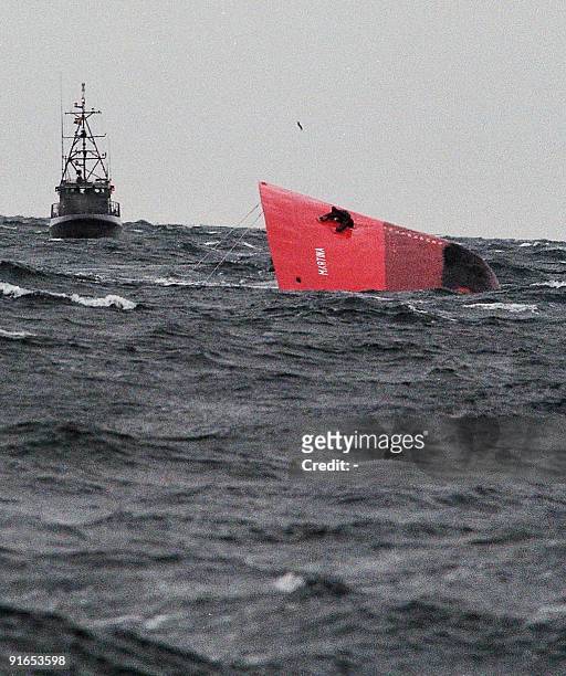 The bow of the Liberian-registered tanker 'Martina' sinks into the waves off the Swedish coast following a collision with a German container ship in...