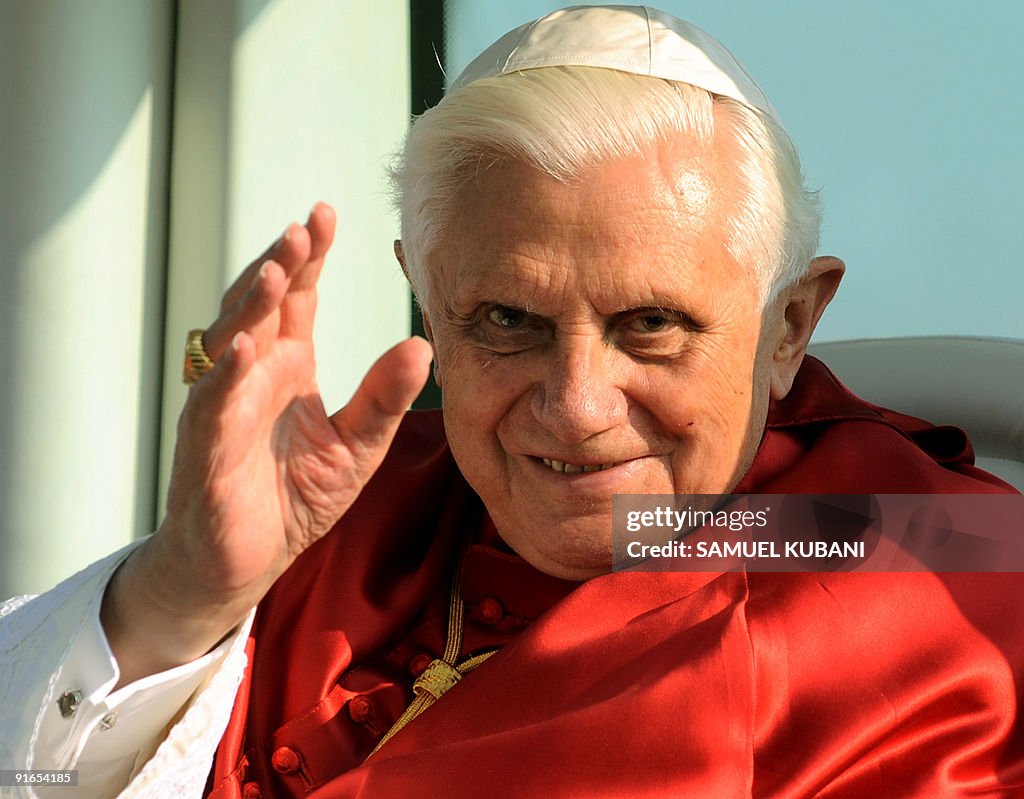 Pope Benedict XVI waves to the faithful
