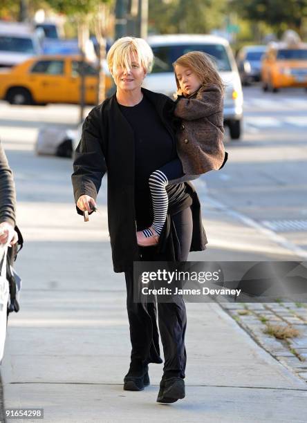 Deborrah-Lee Furness carries her daughter Ava Eliot on the streets of Manhattan on October 7, 2009 in New York City.
