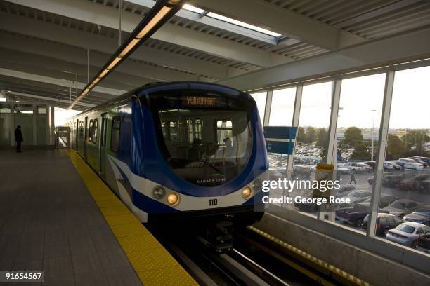 SkyTrain light rail rapid transit train arrives at the Airport Terminal as seen in this 2009 Vancouver, British Columbia, Canada, cityscape photo....