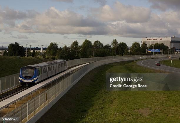 SkyTrain light rail rapid transit train near the Vancouver Airport Terminal heads downtown as seen in this 2009 Vancouver, British Columbia, Canada,...