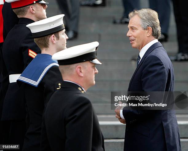 Former Prime Minister Tony Blair talks with military personnel as he attends a service of commemoration to mark the end of combat operations in Iraq...