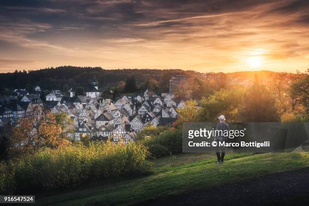 tourist looking at the freudenberg old town, germany. - north rhine westphalia stock pictures, royalty-free photos & images