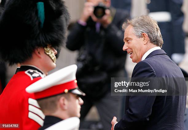 Former Prime Minister Tony Blair talks with military personnel as he attends a service of commemoration to mark the end of combat operations in Iraq...