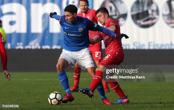 Soufian Benyamina of Rostock battles for the ball with Kai Wagner of Wuerzburg during the 3. Liga match between F.C. Hansa Rostock and FC Wuerzburger...