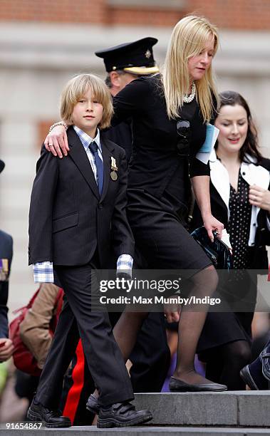 Young boy wearing a medal attends a service of commemoration to mark the end of combat operations in Iraq at St Paul's Cathedral on October 9, 2009...