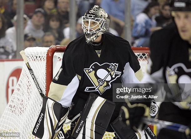 Brent Johnson of the Pittsburgh Penguins eyes the play in the corner against the Phoenix Coyotes at Mellon Arena on October 07, 2009 in Pittsburgh,...