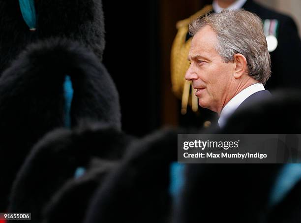 Former Prime Minister Tony Blair talks with military personnel as he attends a service of commemoration to mark the end of combat operations in Iraq...