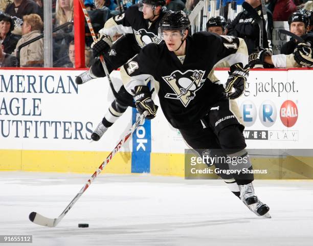Chris Kunitz of the Pittsburgh Penguins moves the puck up ice against the Phoenix Coyotes on October 7, 2009 at Mellon Arena in Pittsburgh,...