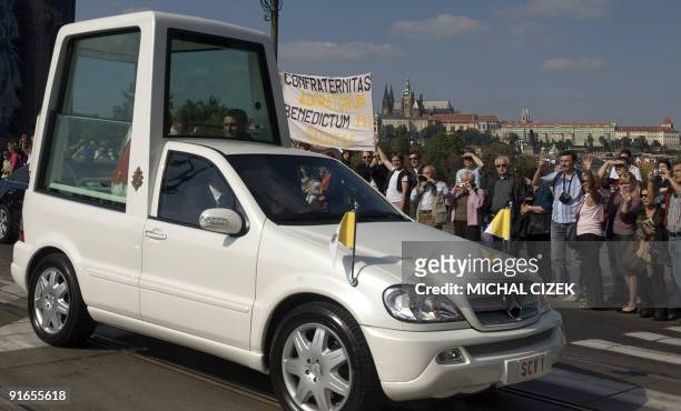 Pope Benedict XVI crosses the bridge of Legions in his popemobile as he travels from the Our Lady Victorious cathedral to the Apostolic nunciature on...