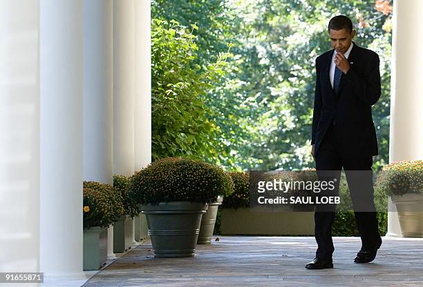President Barack Obama walks to the Rose Garden of the White House in Washington, DC, on October 9, 2009 to address reporters after he won the Nobel...