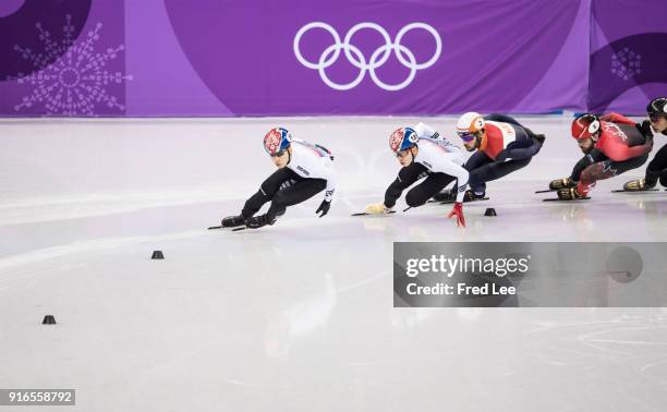 Hyojun Lim of Korea leads Sjinkie Knegt of the Netherlands and Charles Hamelin of Canada during the Men's 1500m Short Track Speed Skating final on...