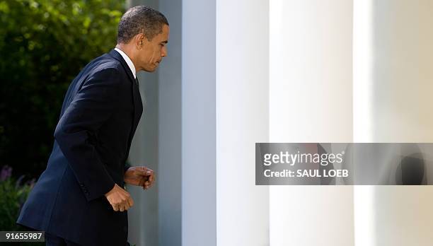 President Barack Obama leaves after speaking at the Rose Garden of the White House in Washington, DC, on October 9, 2009 after he won the Nobel Peace...