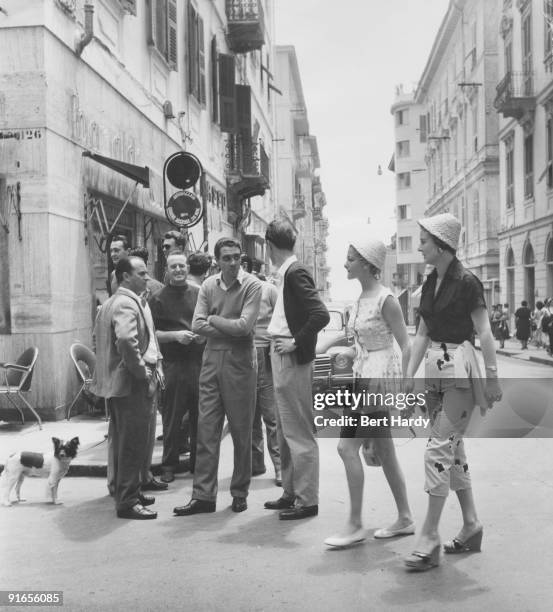 British models Sheila and Jackie take a walk around the Italian city of San Remo, during a cruise of the Cote d'Azur, July 1955. Original Publication...