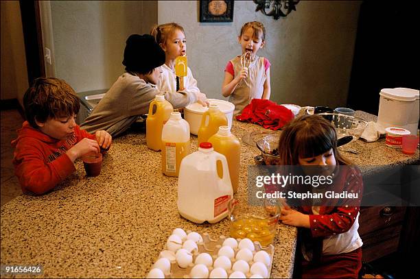 Making Sunday brunch is a family project in this polygamist family consisting of one father, three mothers and 21 children. Three dozen eggs are used...