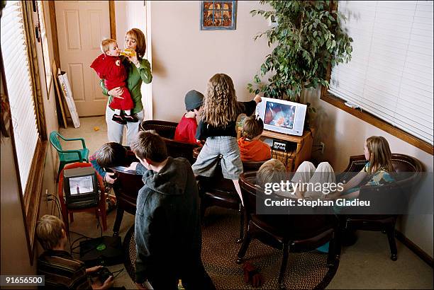 Surfing the web, playing video games and watching TV are among the childrenÕs favorite activities in this polygamist family from the Salt Lake...