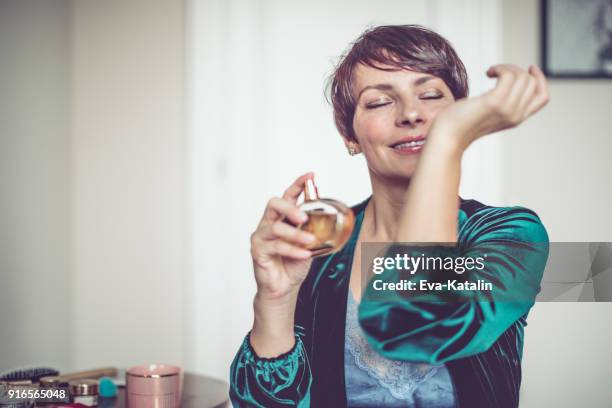 beautiful woman at home - parfum stock pictures, royalty-free photos & images