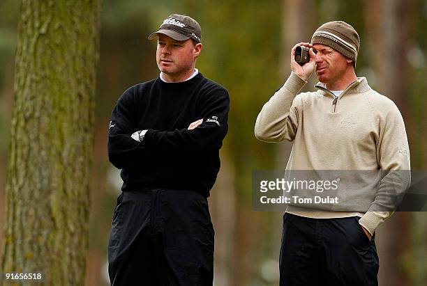 Adrian Ambler and Aaron Wainwright look on during the SkyCaddie PGA Fourball Championship at Forest Pines Golf Club on October 09, 2009 in Broughton,...