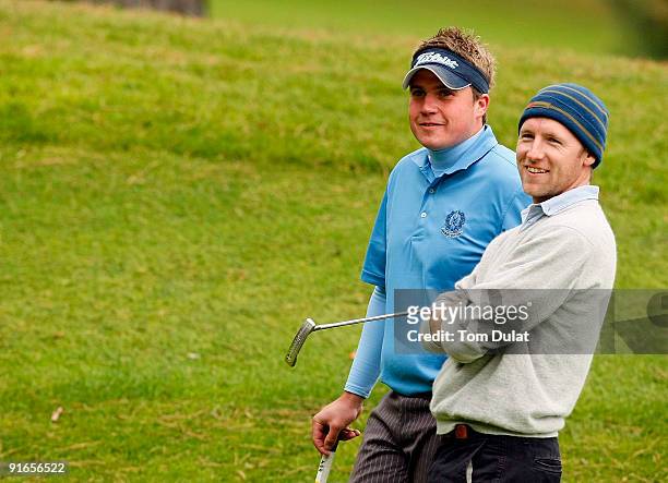 Paddy Devine of Royal Dublin and Stuart Taylor of Island look on during the SkyCaddie PGA Fourball Championship at Forest Pines Golf Club on October...