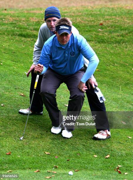 Paddy Devine of Royal Dublin and Stuart Taylor of Island line up a putt on 5th green during the SkyCaddie PGA Fourball Championship at Forest Pines...