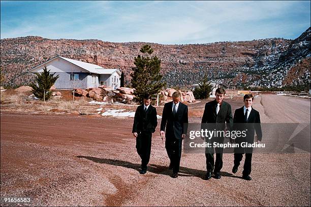 Four of Ray Timpson's sons on their way to Sunday church in Centennial Park, a small polygamist community located at the border of Utah and Arizona....