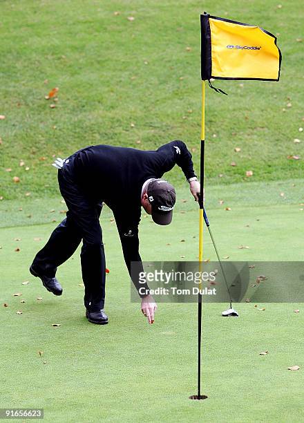 Player marks the ball during the SkyCaddie PGA Fourball Championship at Forest Pines Golf Club on October 09, 2009 in Broughton, England.