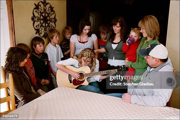 Amanda plays the guitar for her family consisting of one father, three mothers and 20 siblings. Music plays an important role in this polygamist...