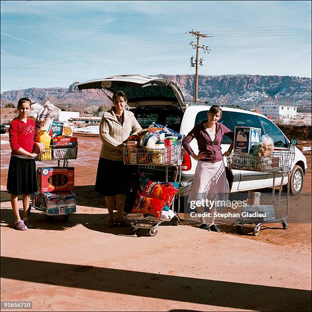 Every Friday morning, Susan Timpson, who is part of the small polygamist community of Centennial Park, goes grocery shopping at the local store with...