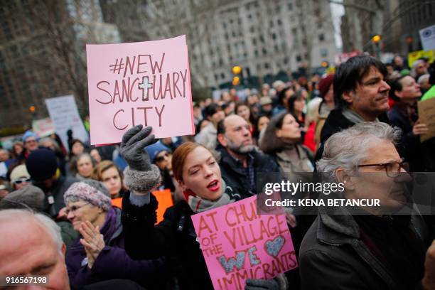 People attend a rally with Immigrant rights activist Ravi Ragbir a day after he granted temporary stay of deportation in Foley Square on February 10,...