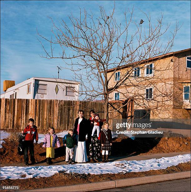 Audrey and Susanna, two sister wives from the small polygamist community of Centennial Park, at the border of Utah and Arizona, pose with Audrey's...