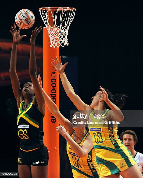 Romelda Aiken of Jamiaca comes under pressure from Susan Fuhrmann and Bianca Chatfield during the World Netball series match between Australia and...