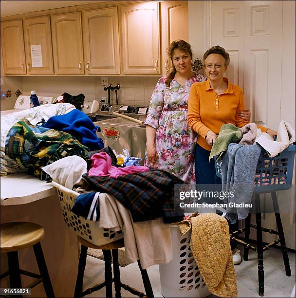 Jessikah and Joyce, two sister-wives from the small polygamist community of Centennial Park at the border of Utah and Arizona, are doing laundry for...