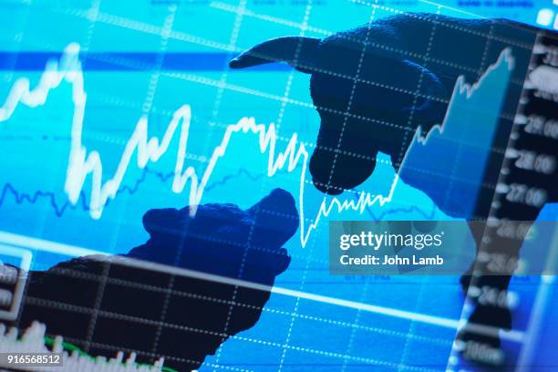 bull and bear stock market - bear market stock pictures, royalty-free photos & images