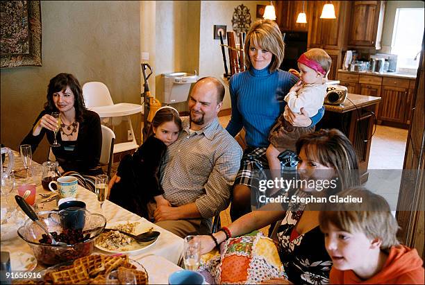 Sunday brunch in a polygamist family consisting of one husband , three wives , and 21 children. Sunday is one of the few days of the week when the...