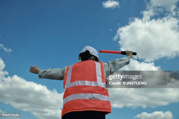 traffic guard holding traffic rod - directing traffic stock pictures, royalty-free photos & images