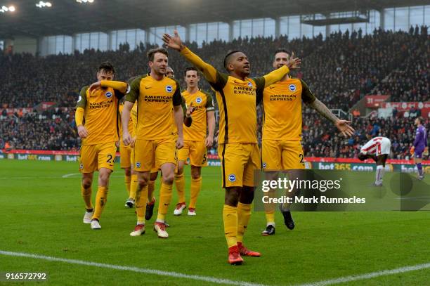 Jose Izquierdo of Brighton and Hove Albion celebrates scoring his side's first goal with team mates during the Premier League match between Stoke...