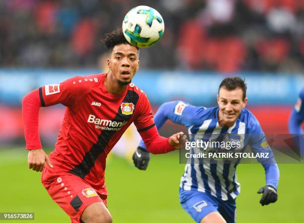 Berlin's Czech midfielder Vladimir Darida and Leverkusen's German defender Benjamin Henrichs vie for the ball during the German first division...