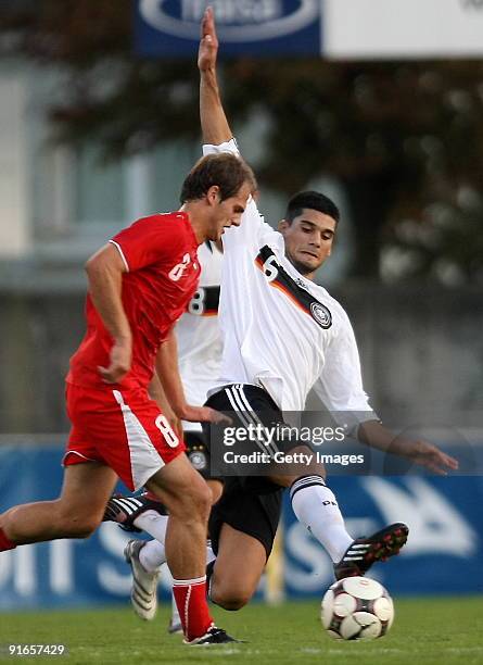 Yalcin Taner of Germany fights for the Ball with Mehmet Ekici of Switzerland during the U20 international friendly match between Switzerland and...