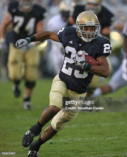 Golden Tate of the Notre Dame Fighting Irish runs against the Washington Huskies on his way to a 67 yard touchdown on October 3, 2009 at Notre Dame...